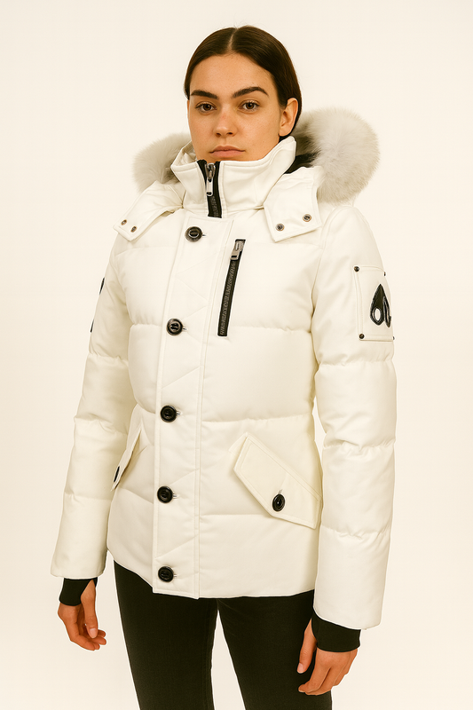 Moose Knuckle Women's White Down Puffer Jacket, size XS, with a fur-trimmed hood and black hardware.