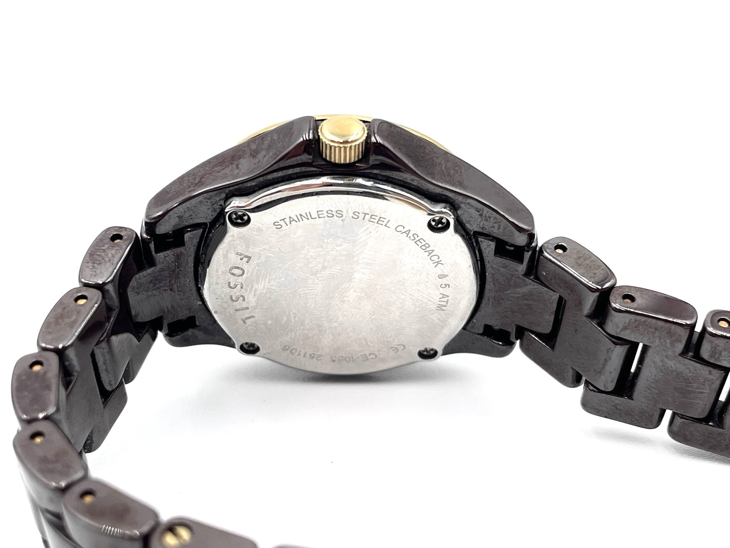 Fossil Tortoise Watch CE1055, stainless steel caseback, gold-tone crown, and dark tortoise-style link bracelet.