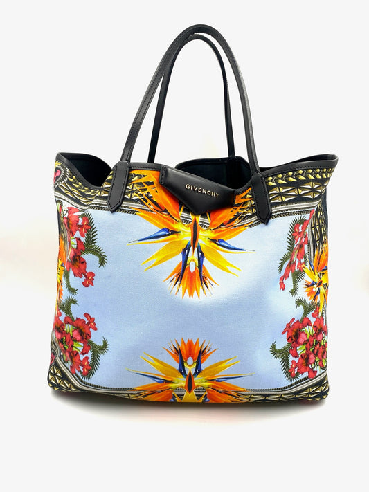 Givenchy Antigona Multicolor Printed Tote with black leather trim, handles, and a vibrant floral and geometric pattern.
