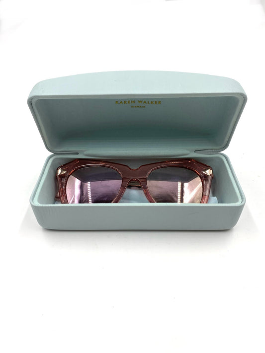 Karen Walker pink mirrored cateye sunglasses in a light blue case.