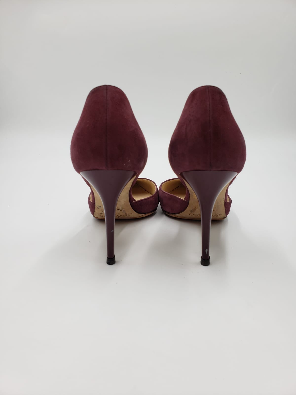 Prada maroon suede pointed toe pumps, size 38.5, with stiletto heels, viewed from the back.