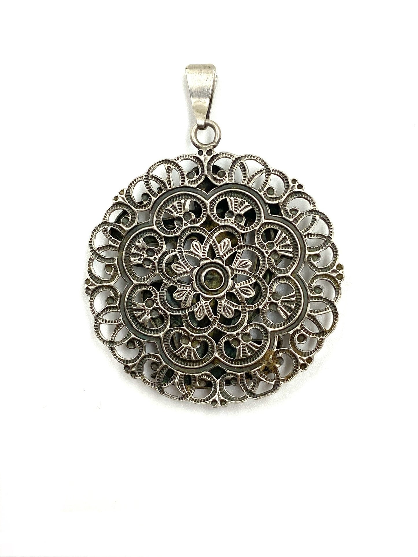 Vintage sterling silver Sagittarius pendant, 1.0” wide, with intricate filigree and floral design.