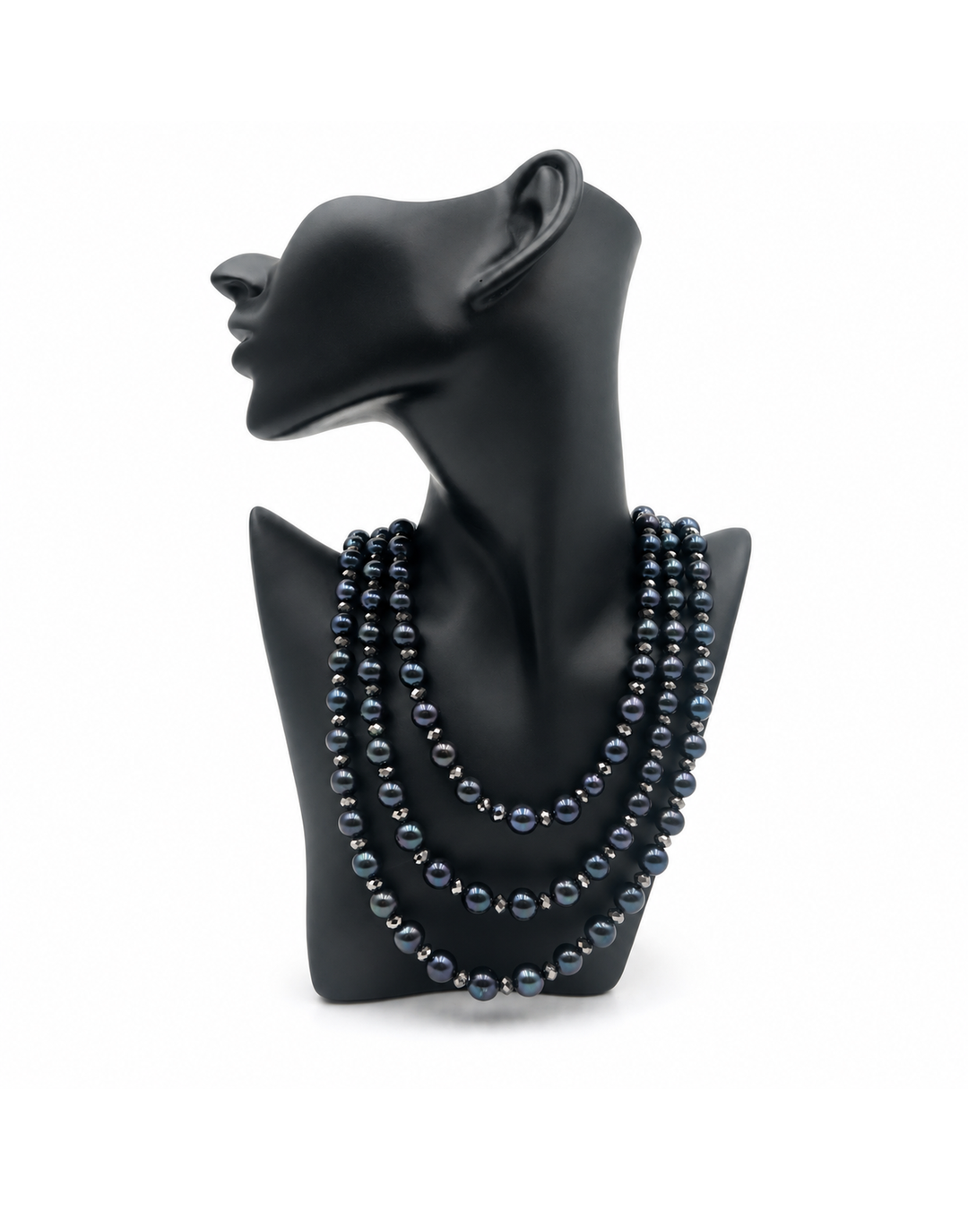 Triple strand necklace featuring black pearls and sparkling Swarovski crystals on a black mannequin bust.