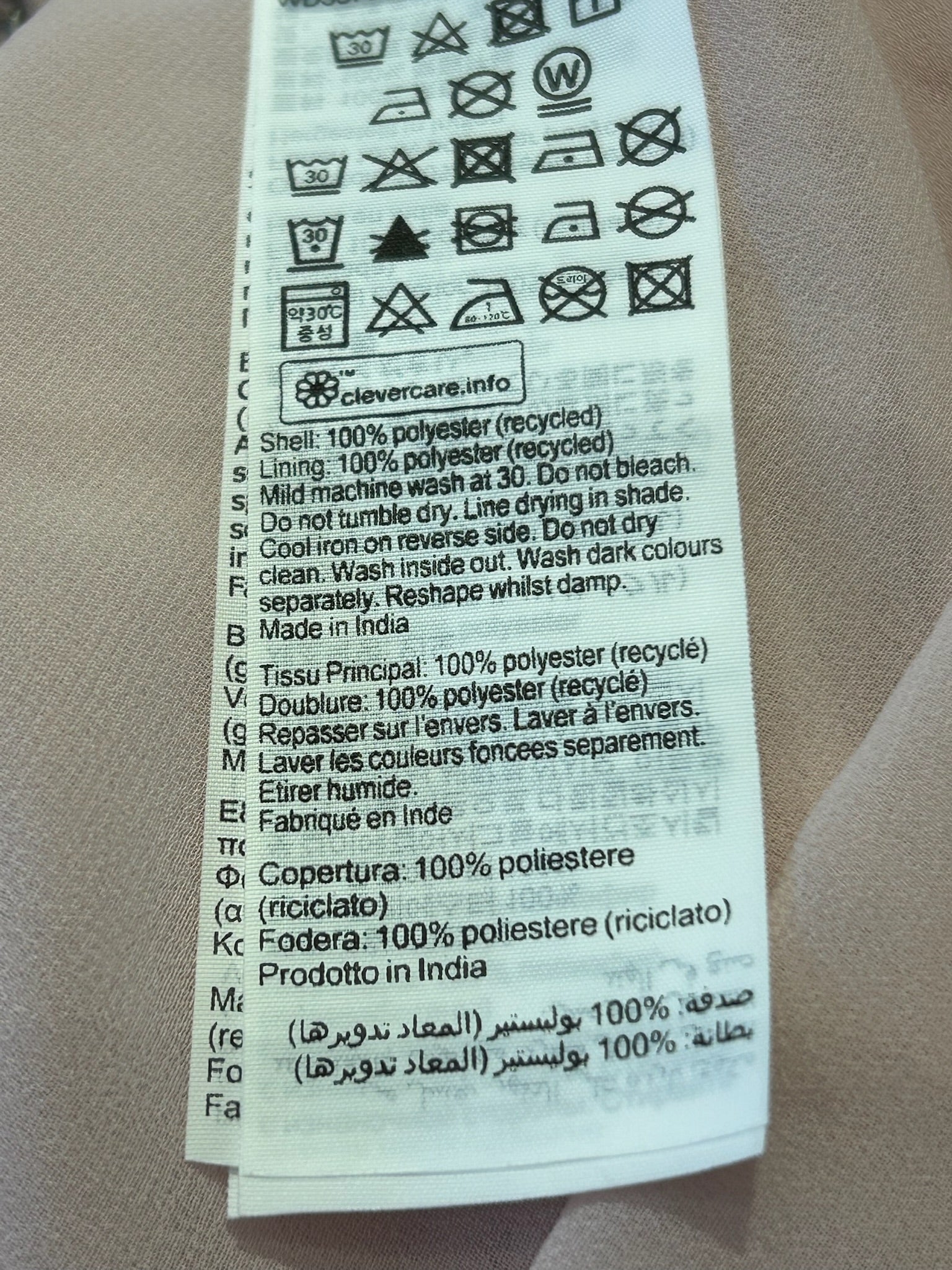 All Saints Nouval Waktu dress care tag, 100% recycled polyester, Made in India.
