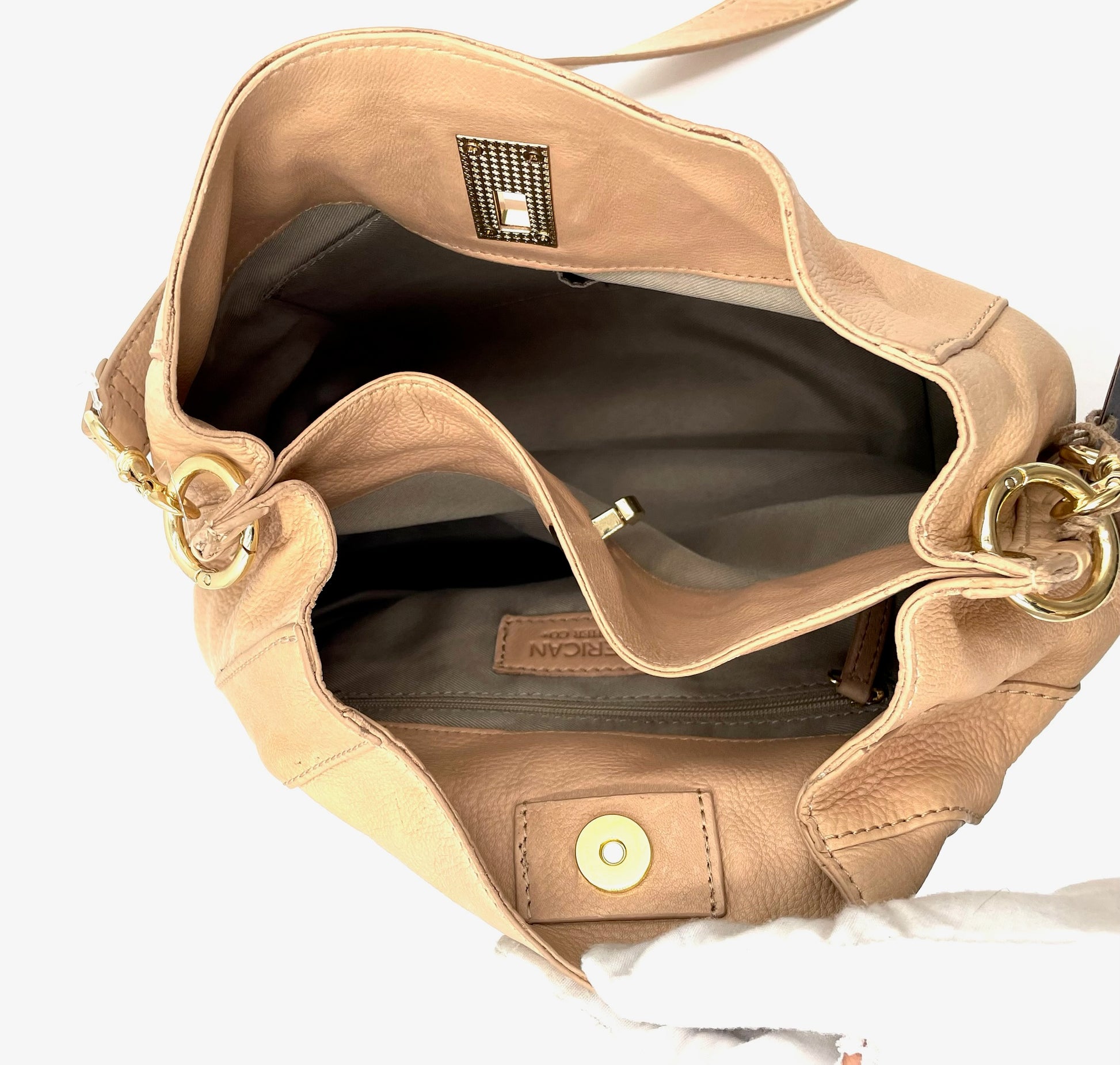 Open beige leather shoulder bag with gold hardware, braided sides, and magnetic snap closure.