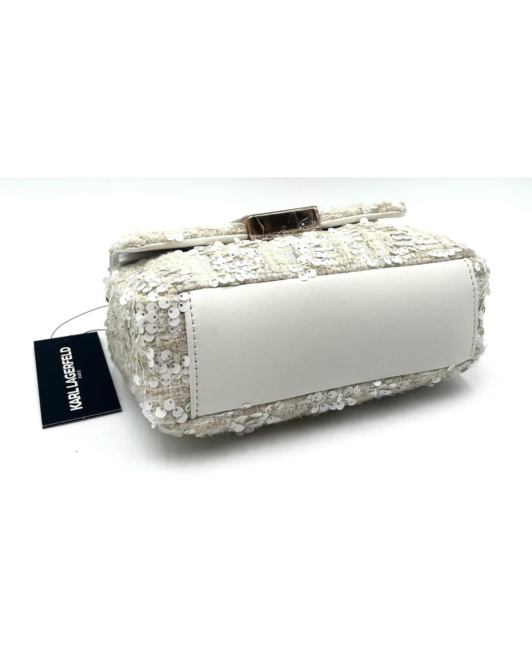 Cream Karl Lagerfeld Lafayette sequin crossbody bag with white leather base and branded tag on a white background.