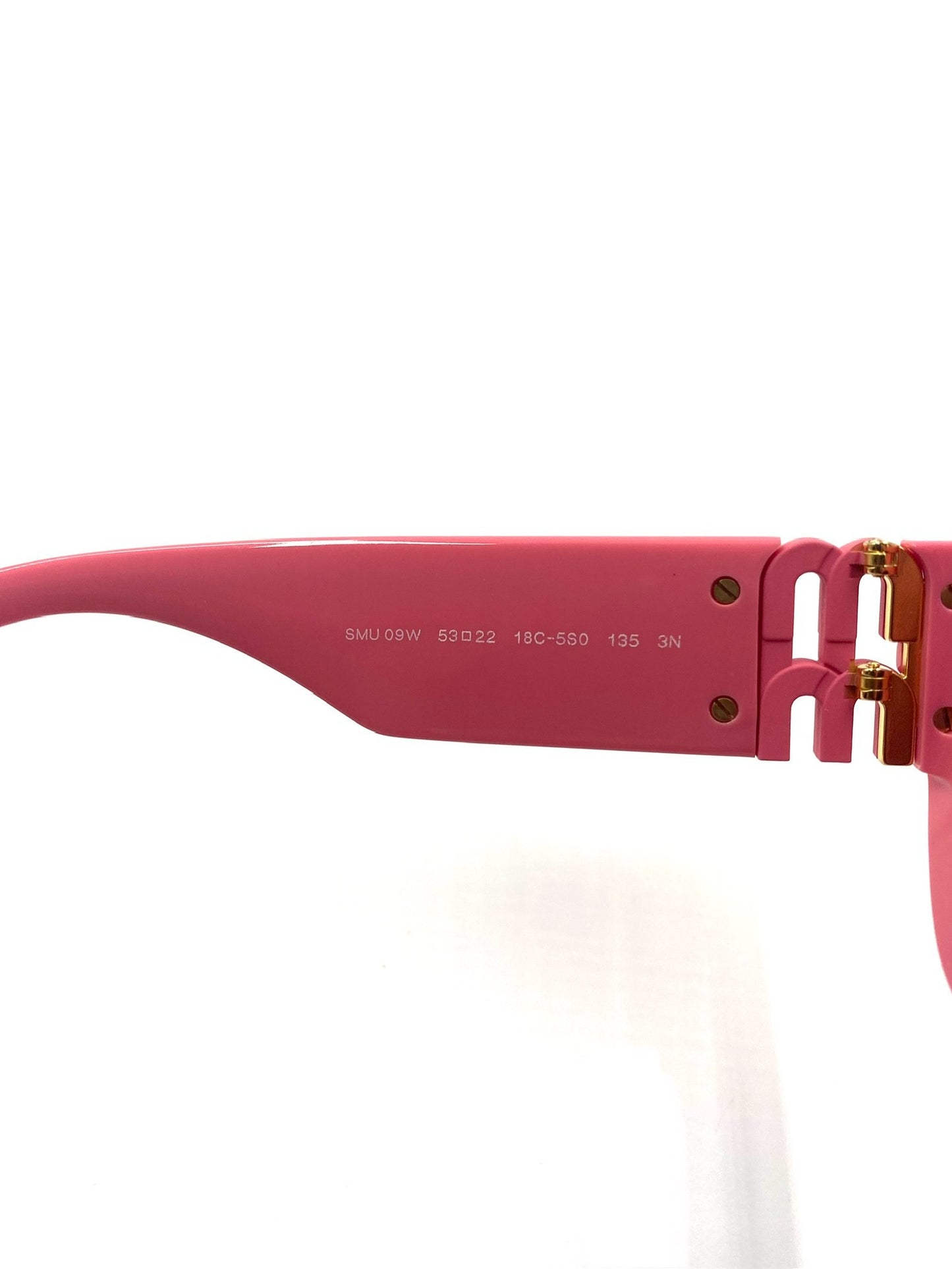 Close-up of Miu Miu pink rectangular sunglasses arm with style number SMU 09W and logo lettering.