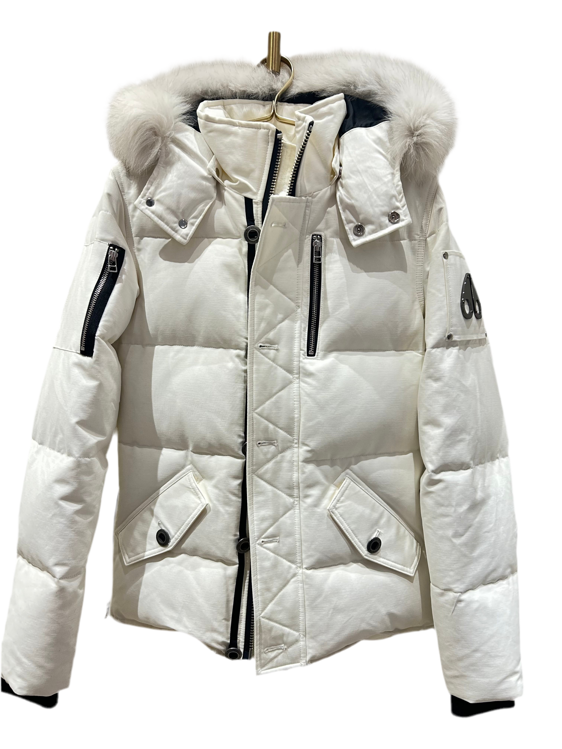 Moose Knuckle Women's White Down Puffer Jacket, Size XS, with fur-trimmed hood and black zippers.