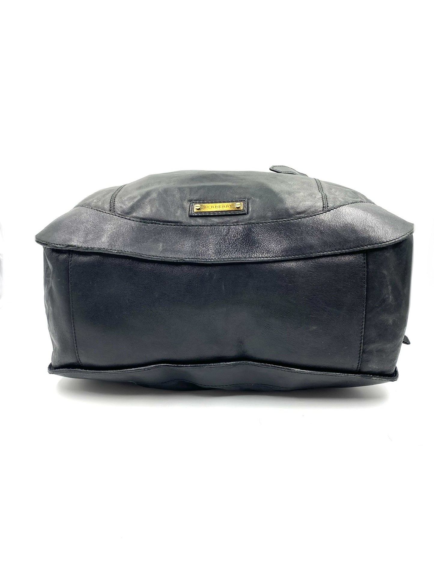 Burberry Black Large Leather Handbag with gold hardware and magnetic top closure.