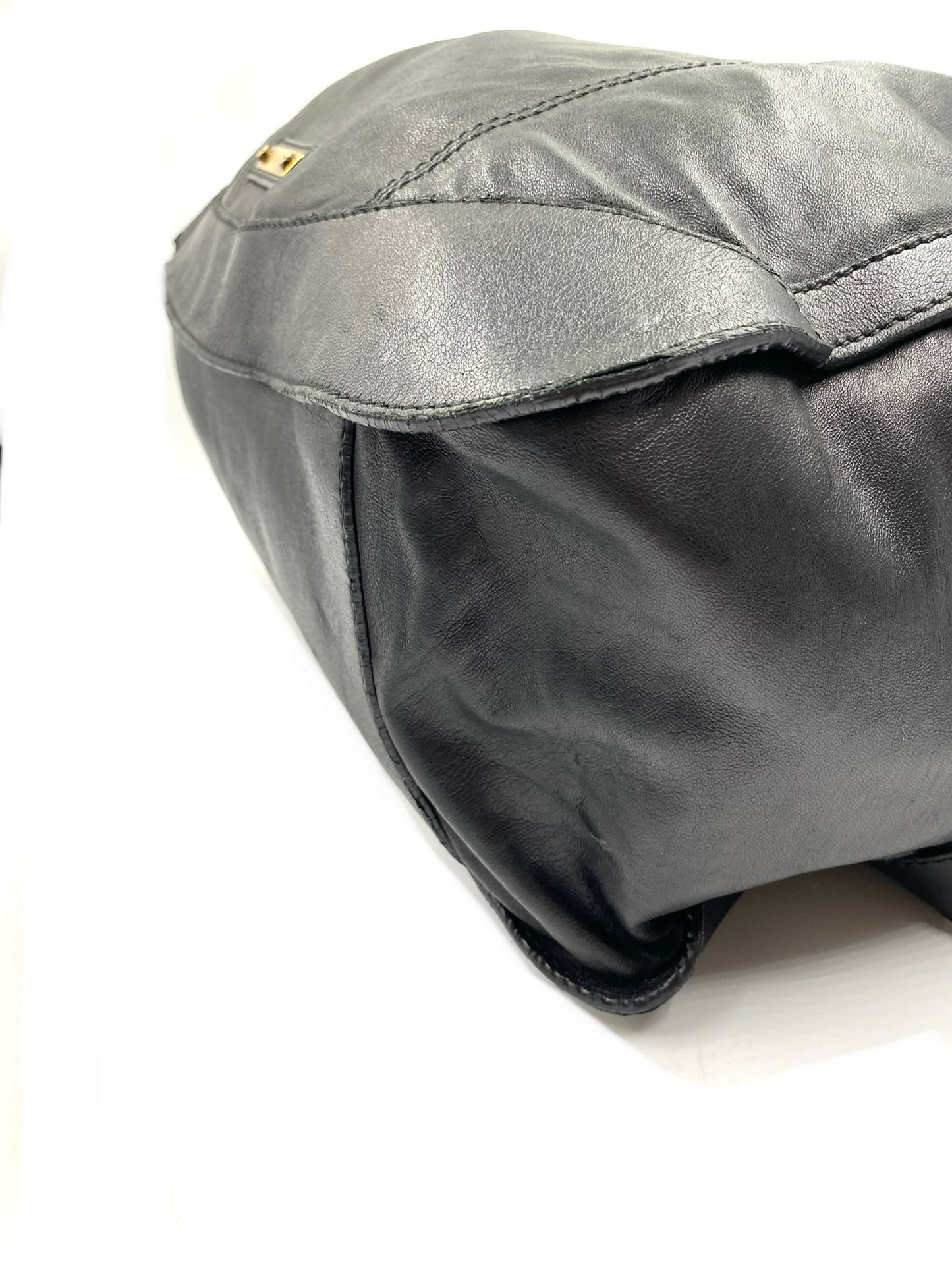 Burberry Black Large Leather Handbag with gold hardware and magnetic top closure.