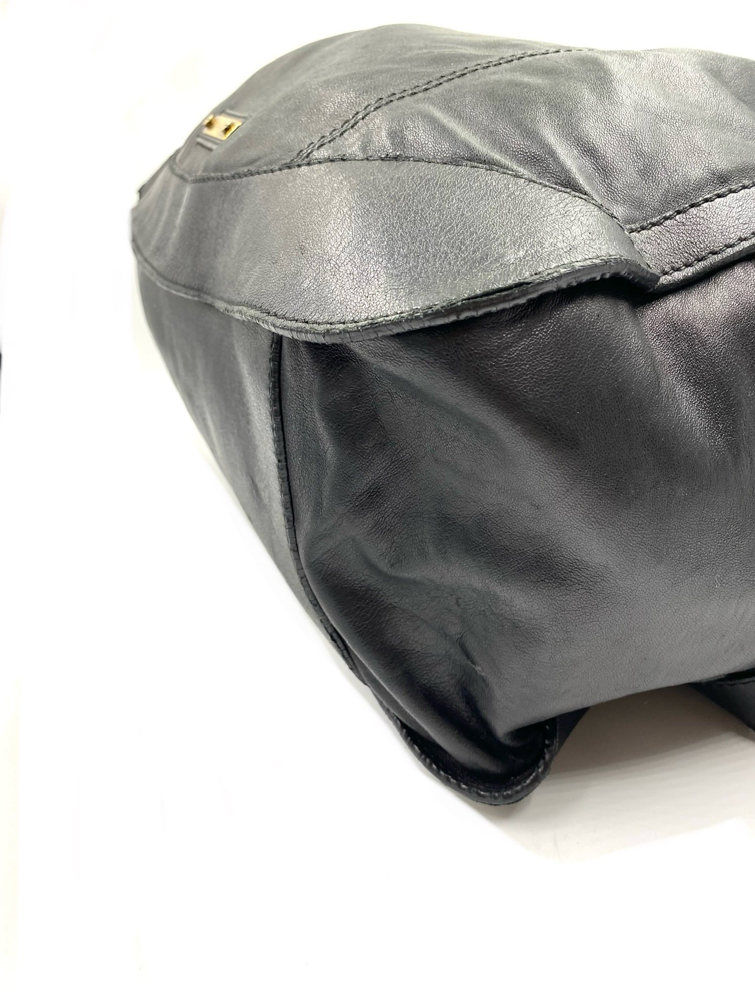 Burberry Black Large Leather Handbag with gold hardware and magnetic top closure.
