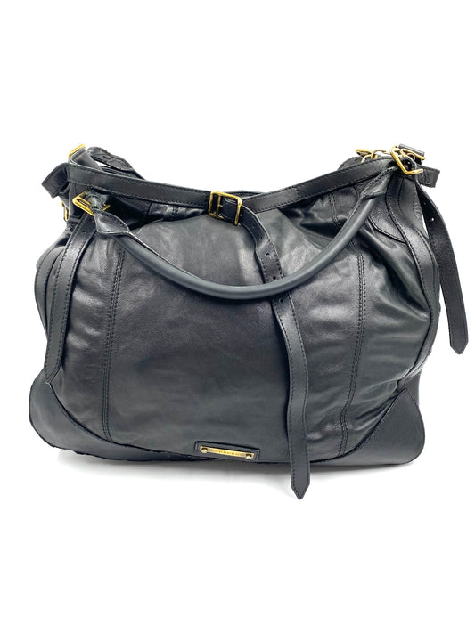 Burberry Black Large Leather Handbag with gold hardware, magnetic closure, and adjustable straps.