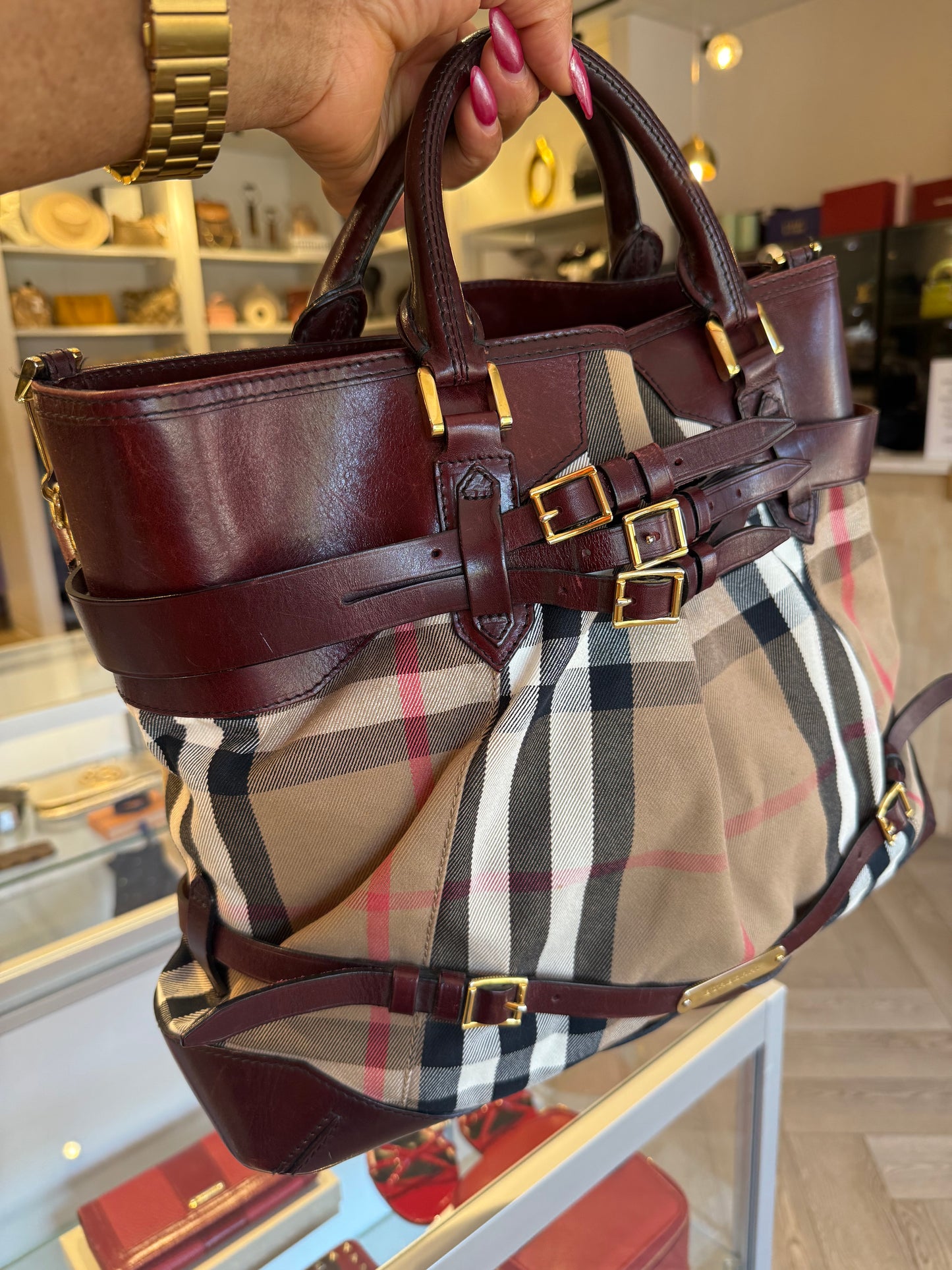 Burberry Burgundy Leather Bridle House Check Tote with brass buckles and rolled handles.