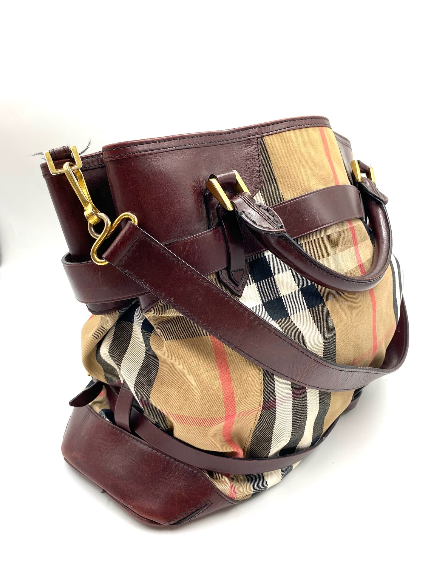 Burberry Burgundy Leather Bridle House Check Tote with rolled handles and brass hardware.