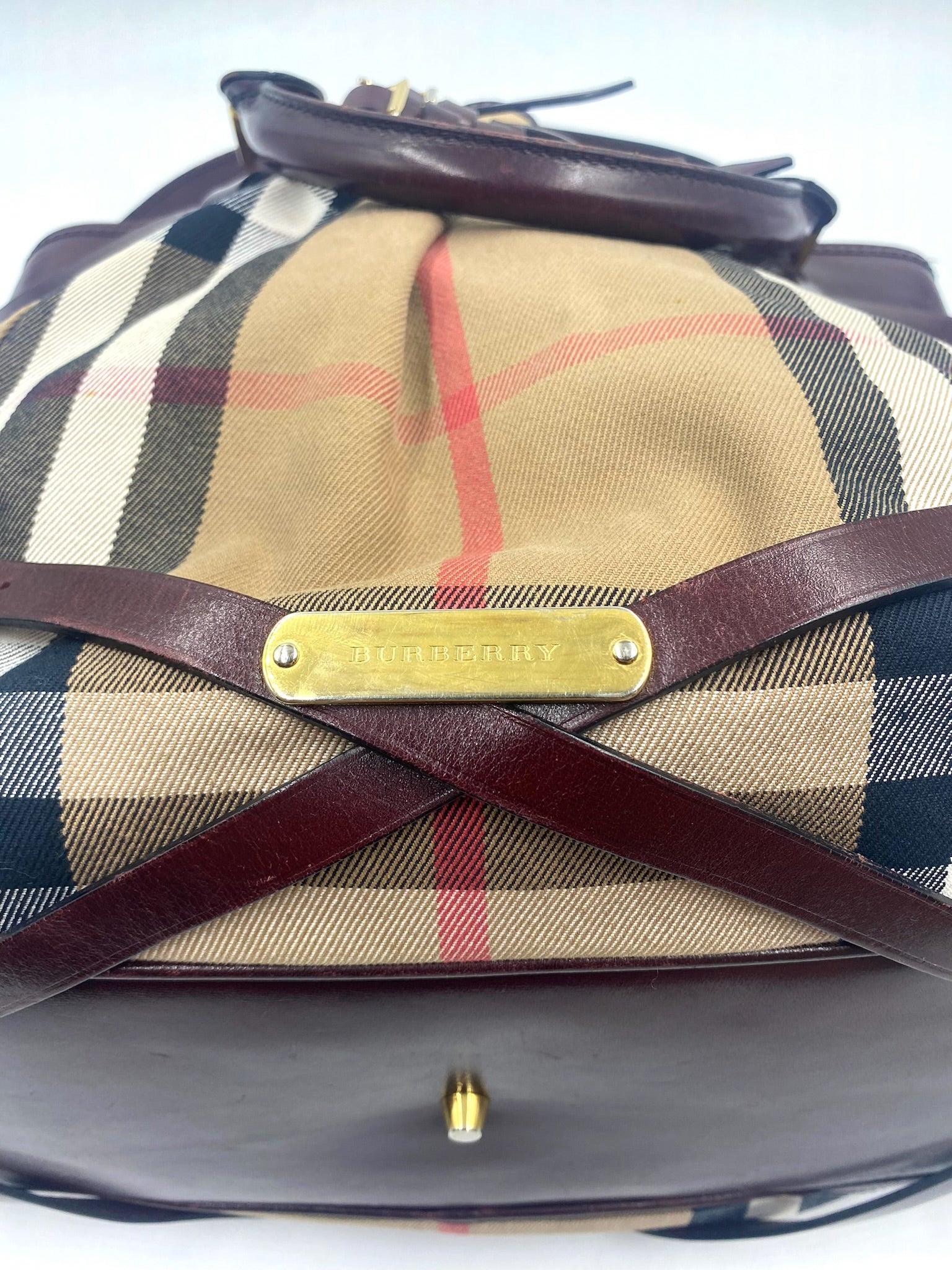Burberry Burgundy Leather Bridle House Check Tote with brass logo plate and rolled handles.