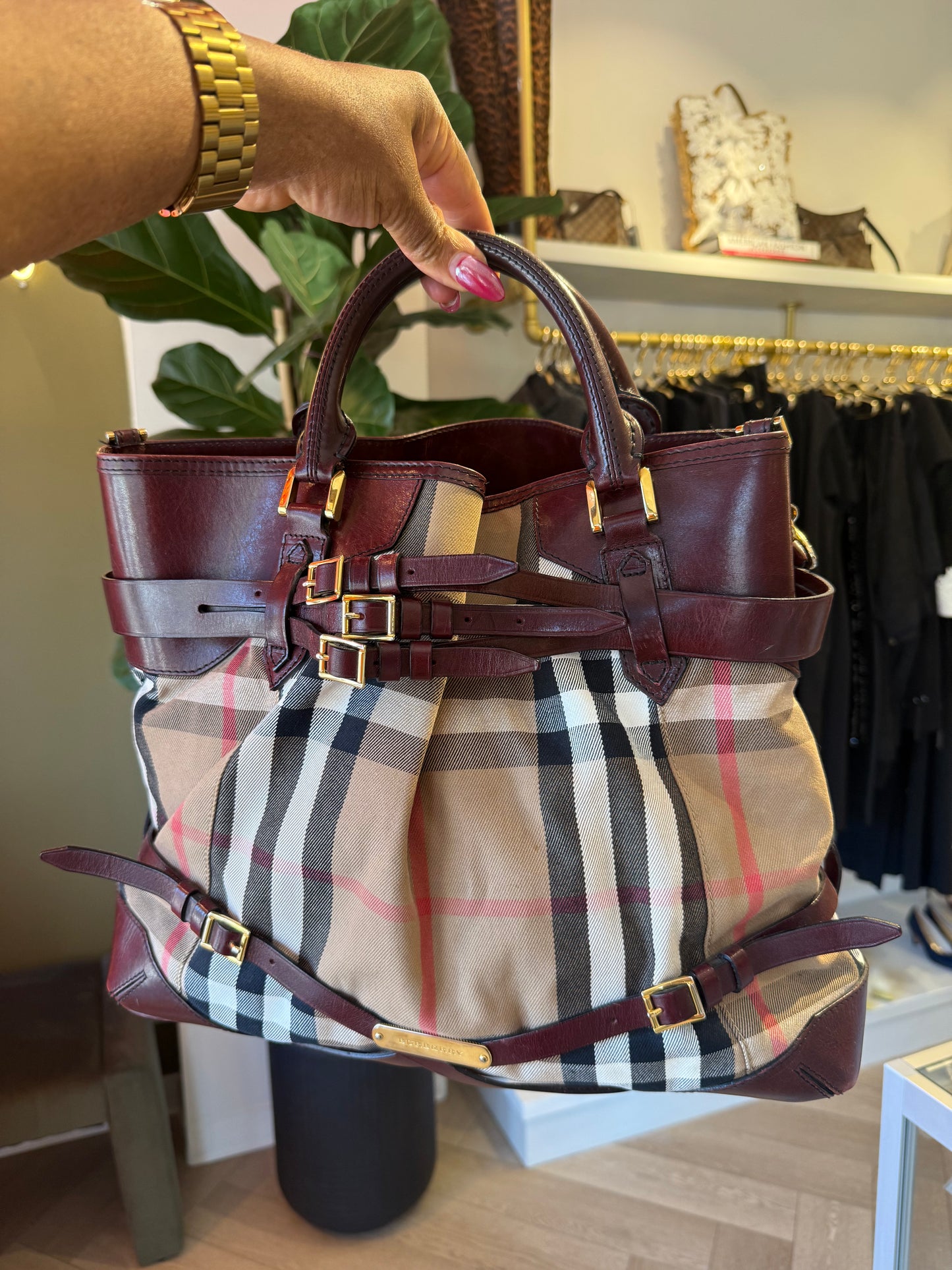 Burberry Burgundy Leather Bridle House Check Tote with rolled handles, brass links, and buckle embellishments.