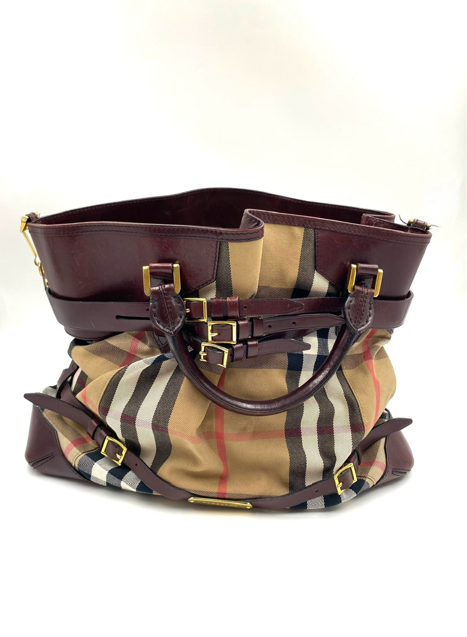 Burberry Burgundy Leather Bridle House Check Tote with rolled handles and brass buckle embellishments.