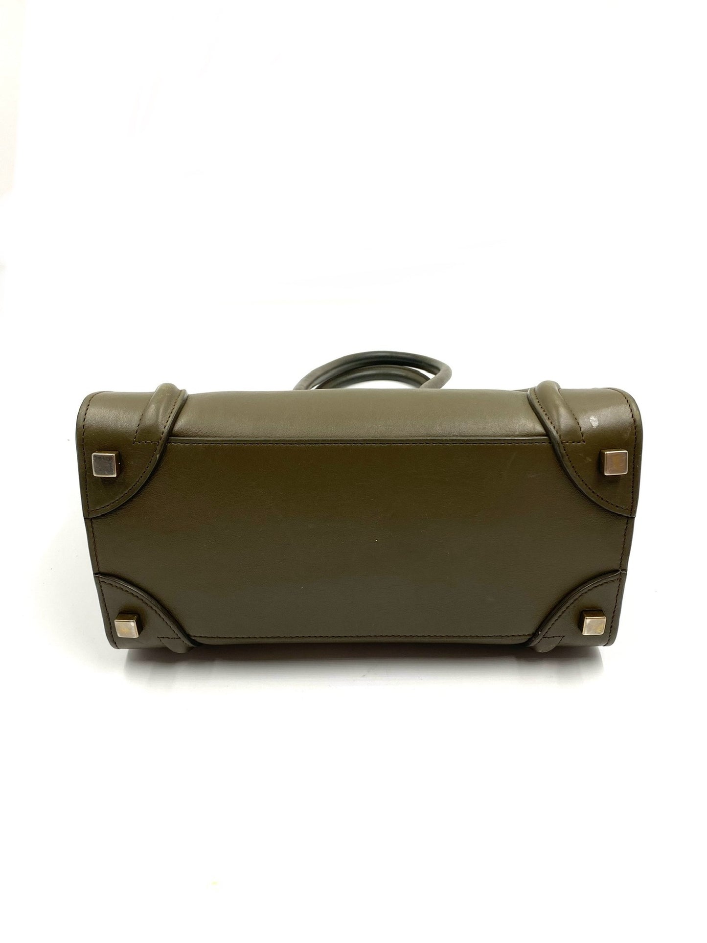 Celine Olive Calfskin Micro Luggage Tote bottom with gold-tone hardware feet.
