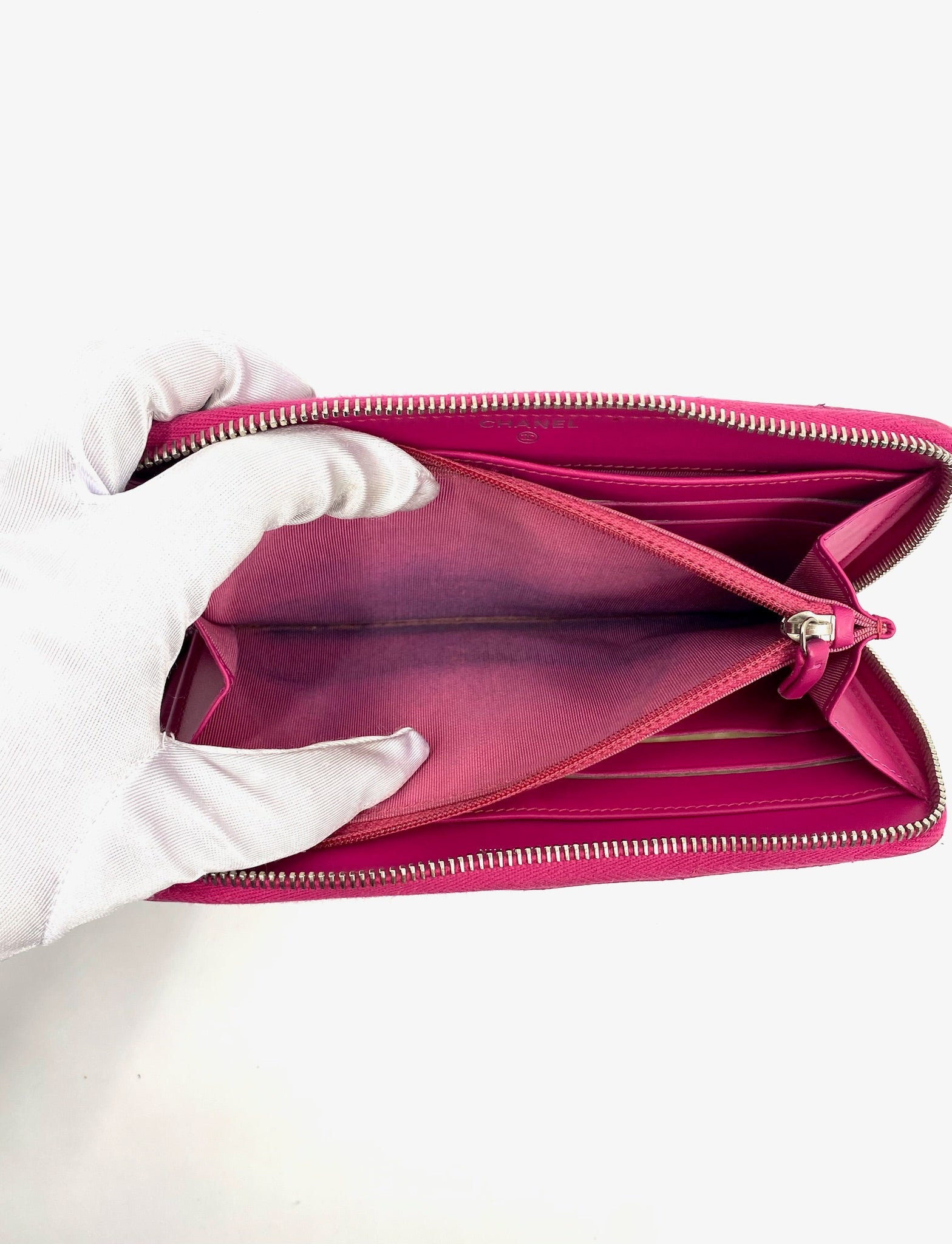 Open Chanel Pink Long Caviar Zip Wallet with silver hardware and interior stain.