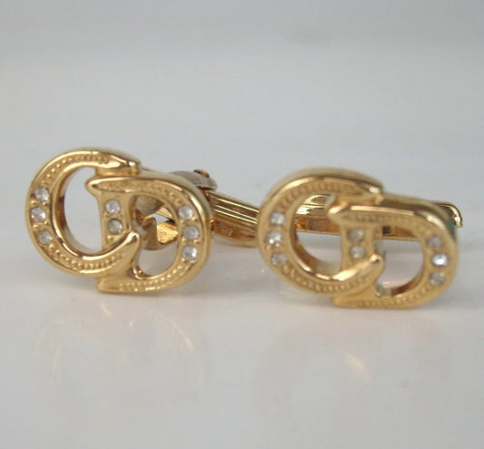 Christian Dior gold plated rhinestone cufflinks with interlocking "CD" logo.