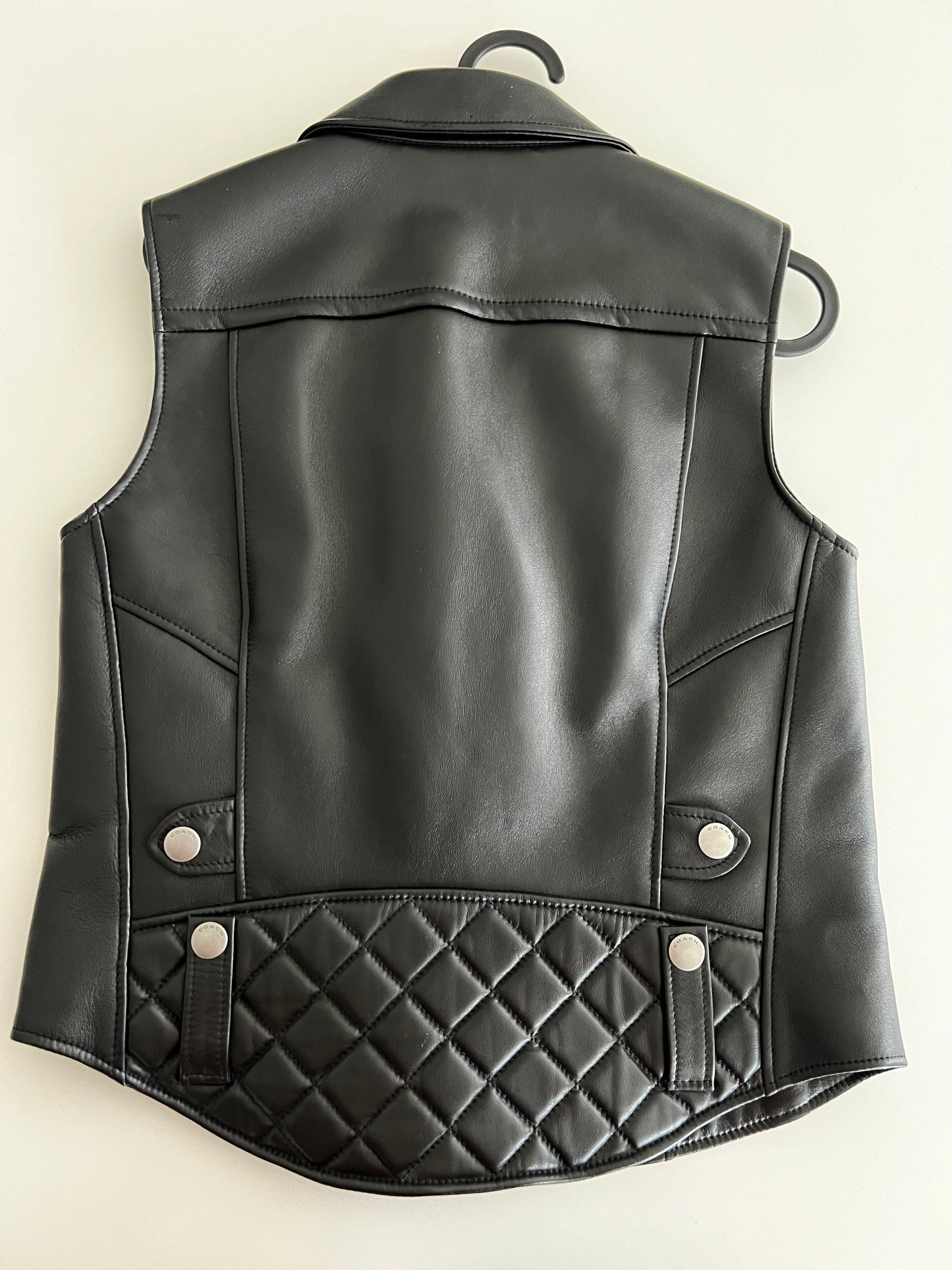 Coach 1941 Applique black leather biker vest, size XS, with quilted lower back and silver snap details.