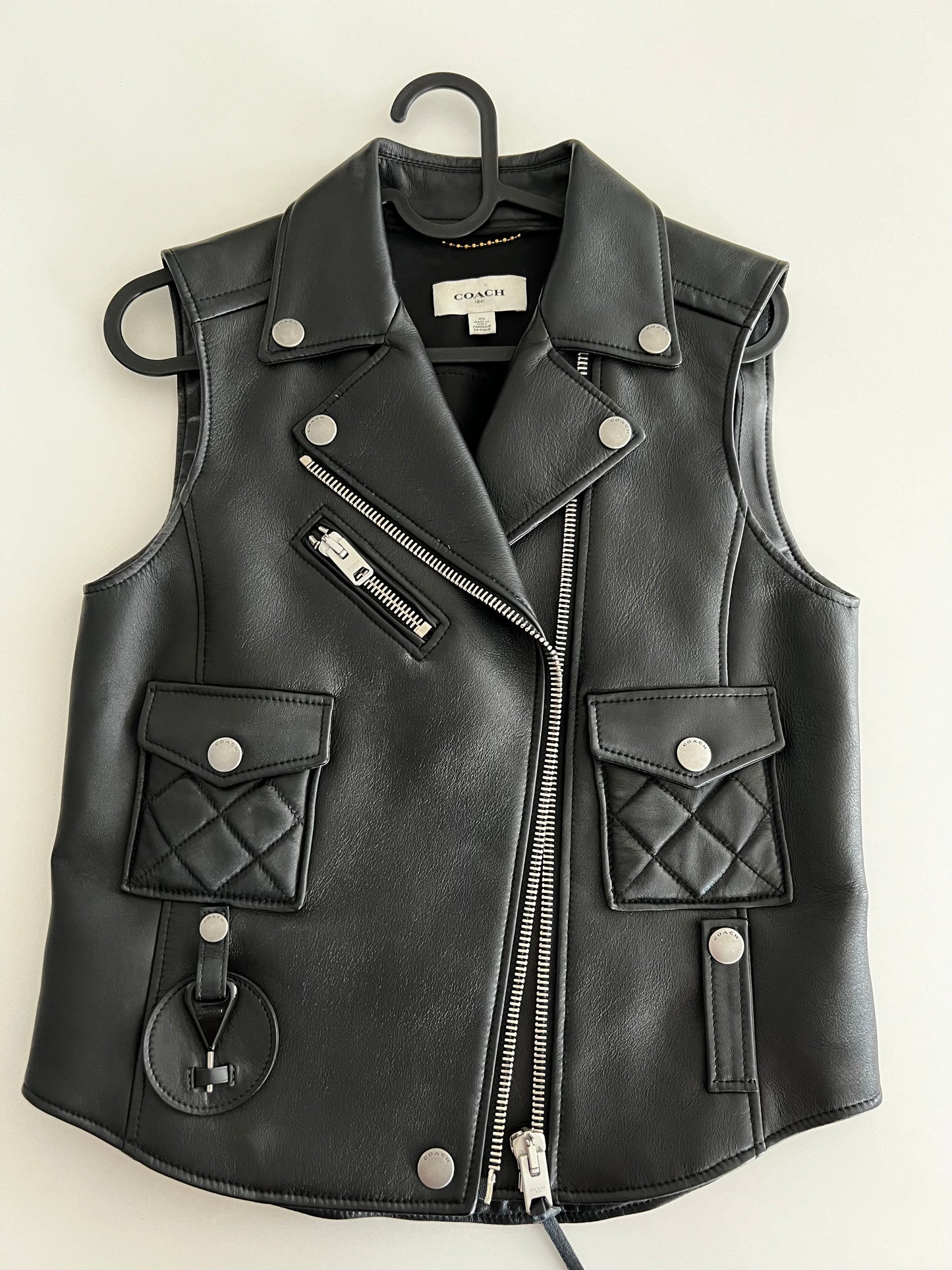 Coach 1941 Applique black leather biker vest, size XS, with silver zippers and snap buttons.