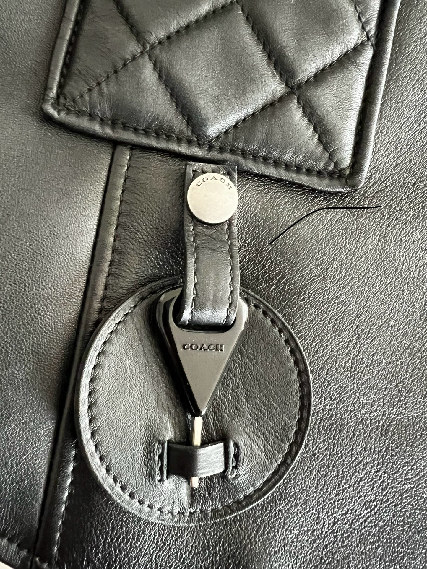 Coach 1941 Applique Black Leather Biker Vest, close-up of quilted detail and silver-tone hardware.