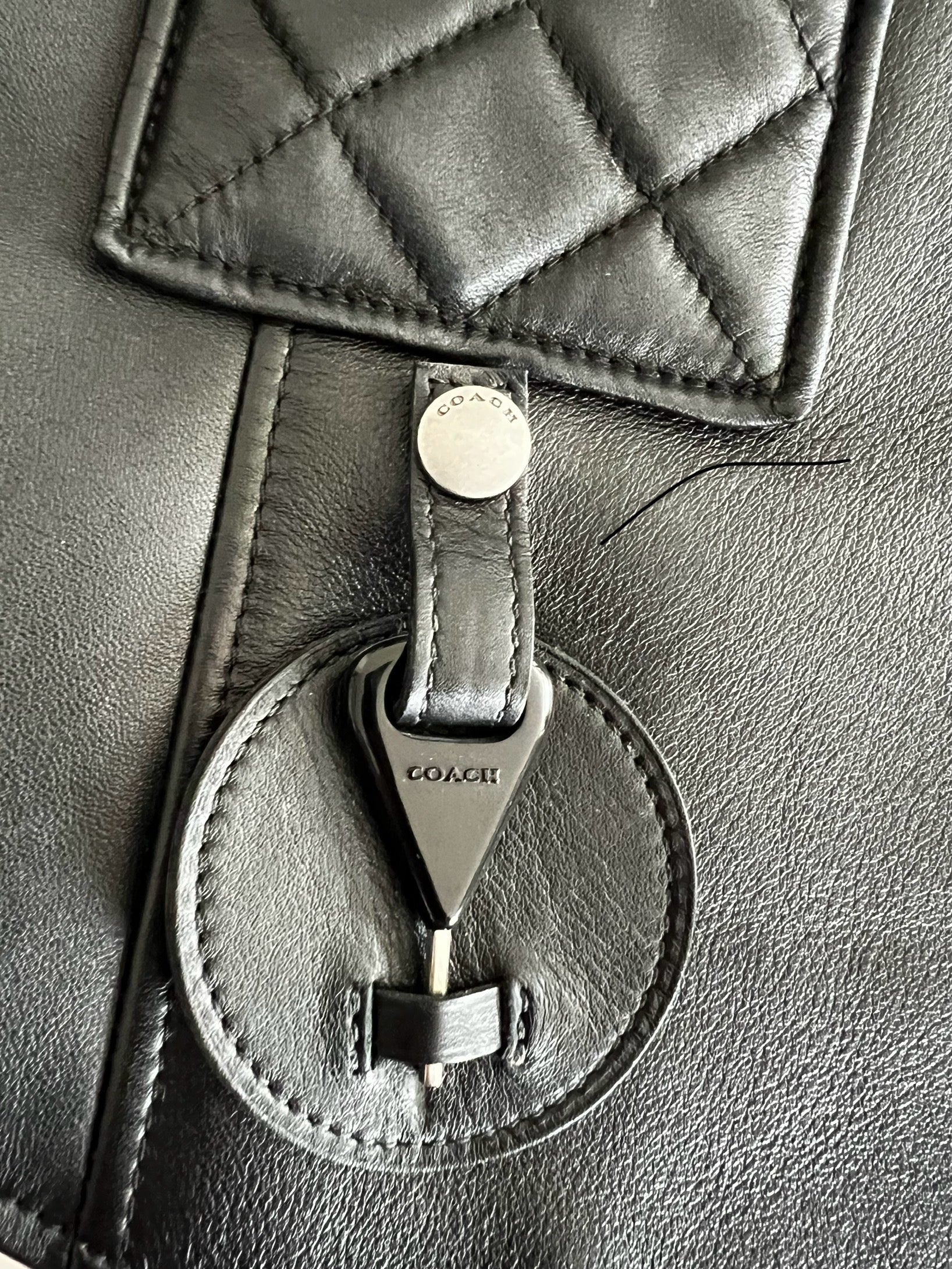 Coach 1941 Applique Black Leather Biker Vest, close-up of quilted detail and silver-tone hardware.