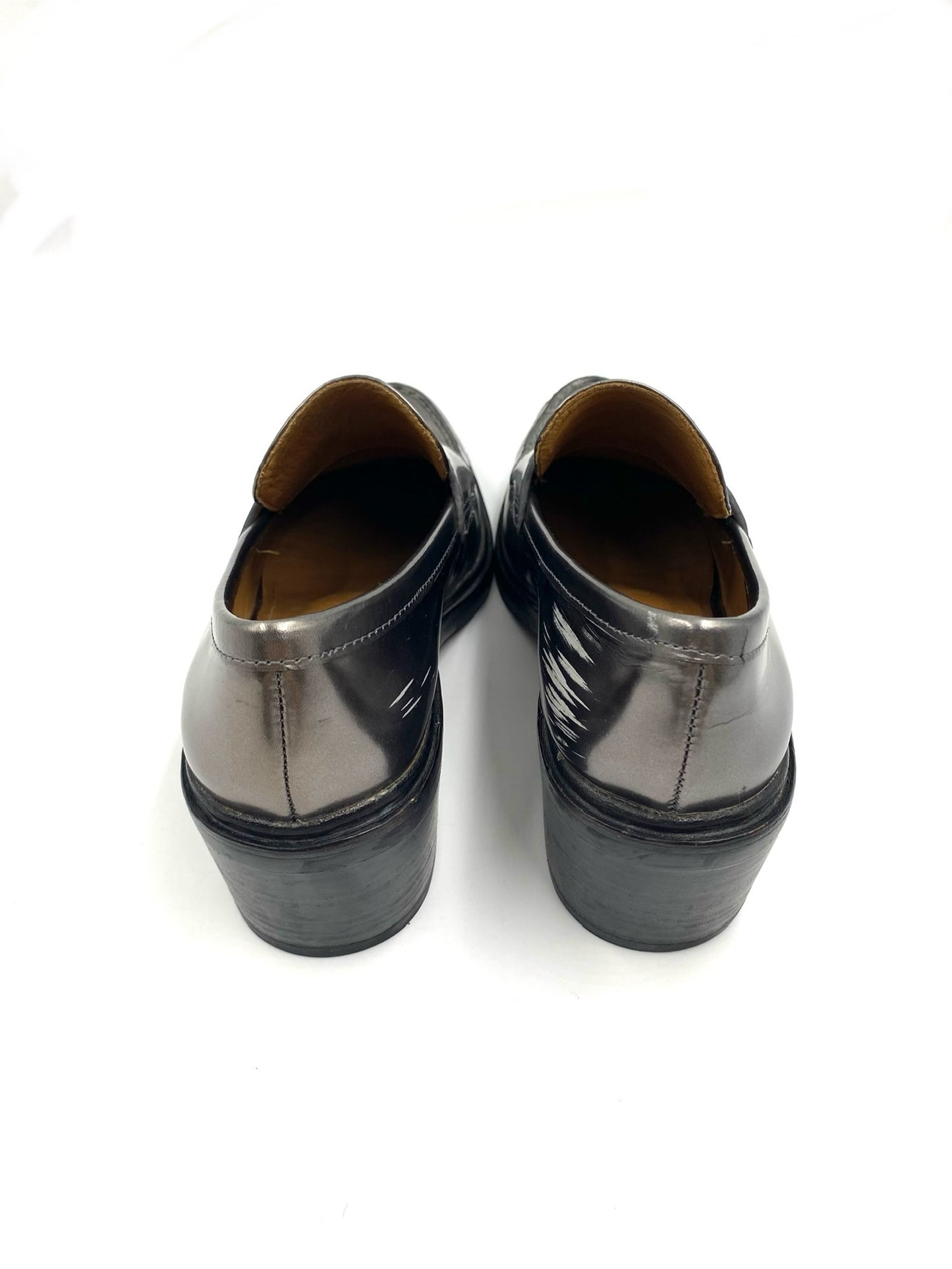 Coach Grey Metallic Loafers, size 8, showing wear and scratches on the metallic leather finish.