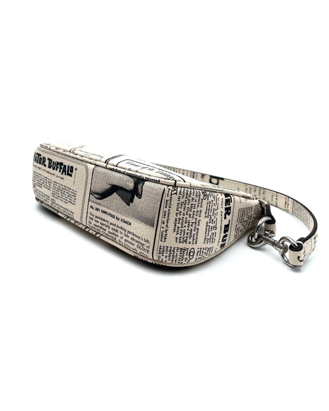 Coach Nolita 19 mini bag in cream pebble leather with a black and white vintage newspaper print and silver hardware.