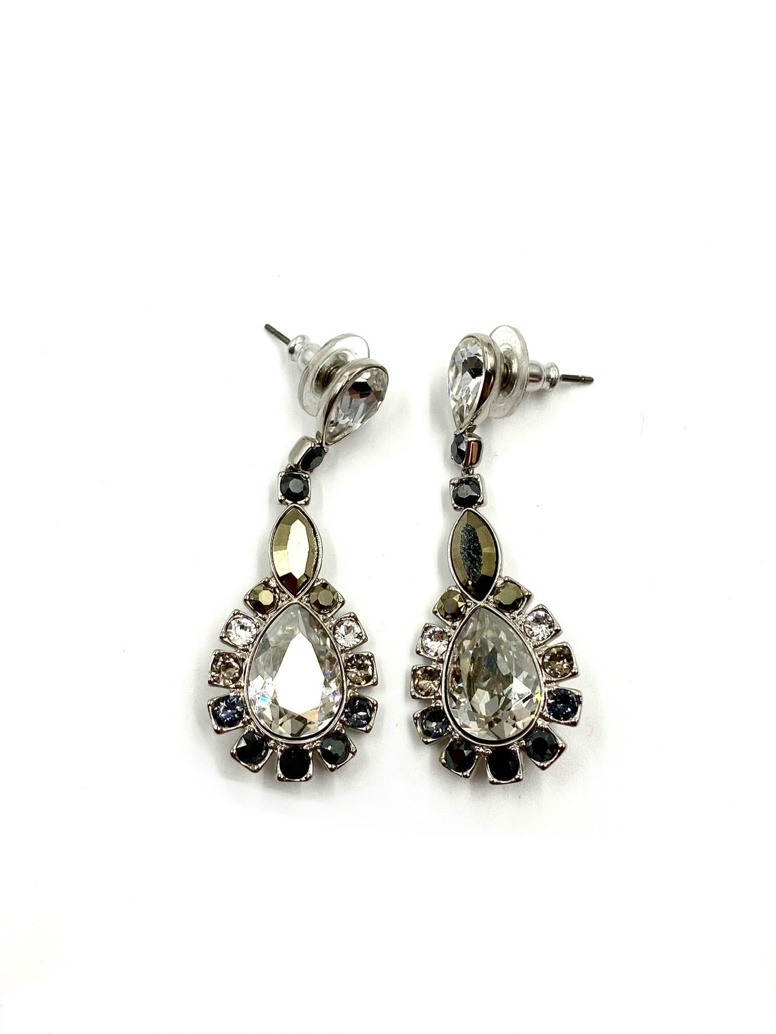Silver-toned drop earrings with large clear cubic zirconia, surrounded by smaller onyx and crystal stones.