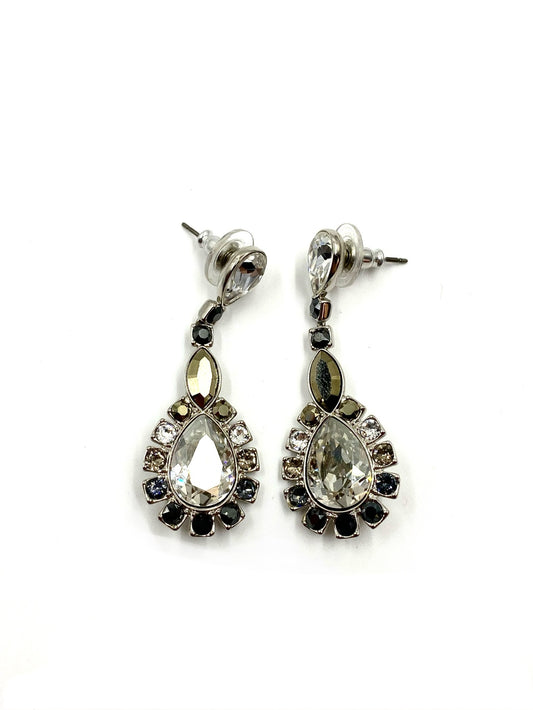 Silver-toned drop earrings with large clear cubic zirconia, surrounded by smaller onyx and crystal stones.