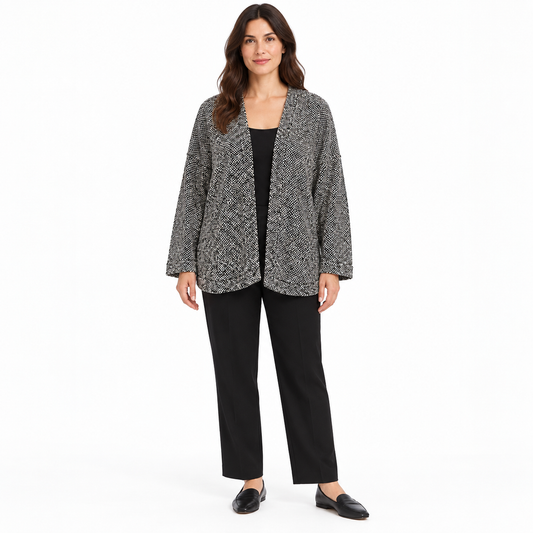 Eileen Fisher black and white textured open cardigan in size M, worn over a black top and trousers.