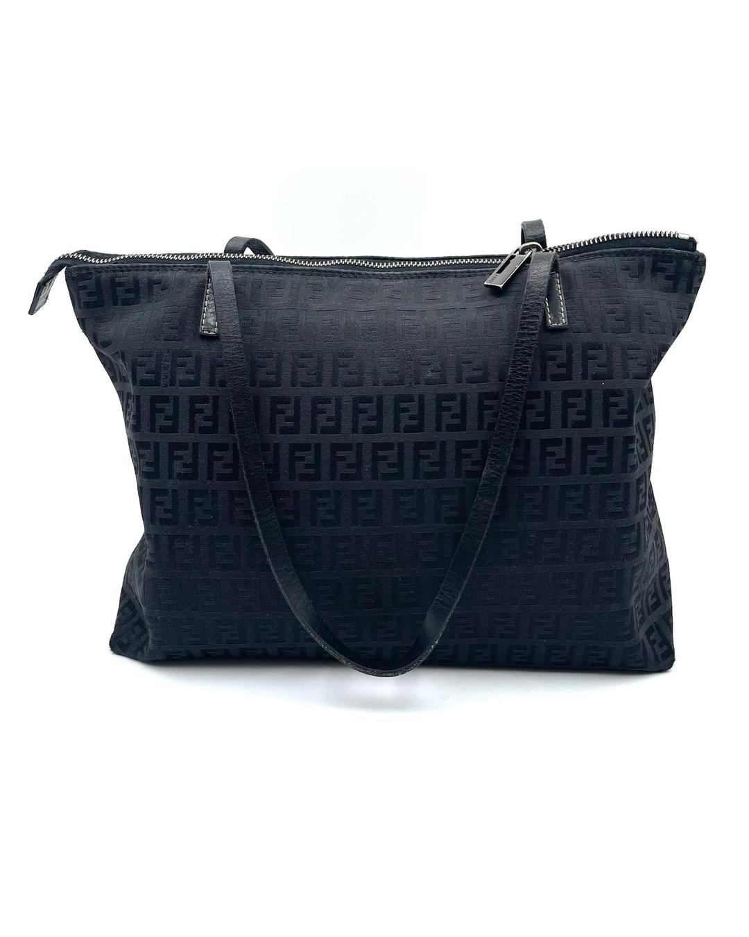 Black Fendi Zucca monogram shoulder tote with top zip closure and leather straps.