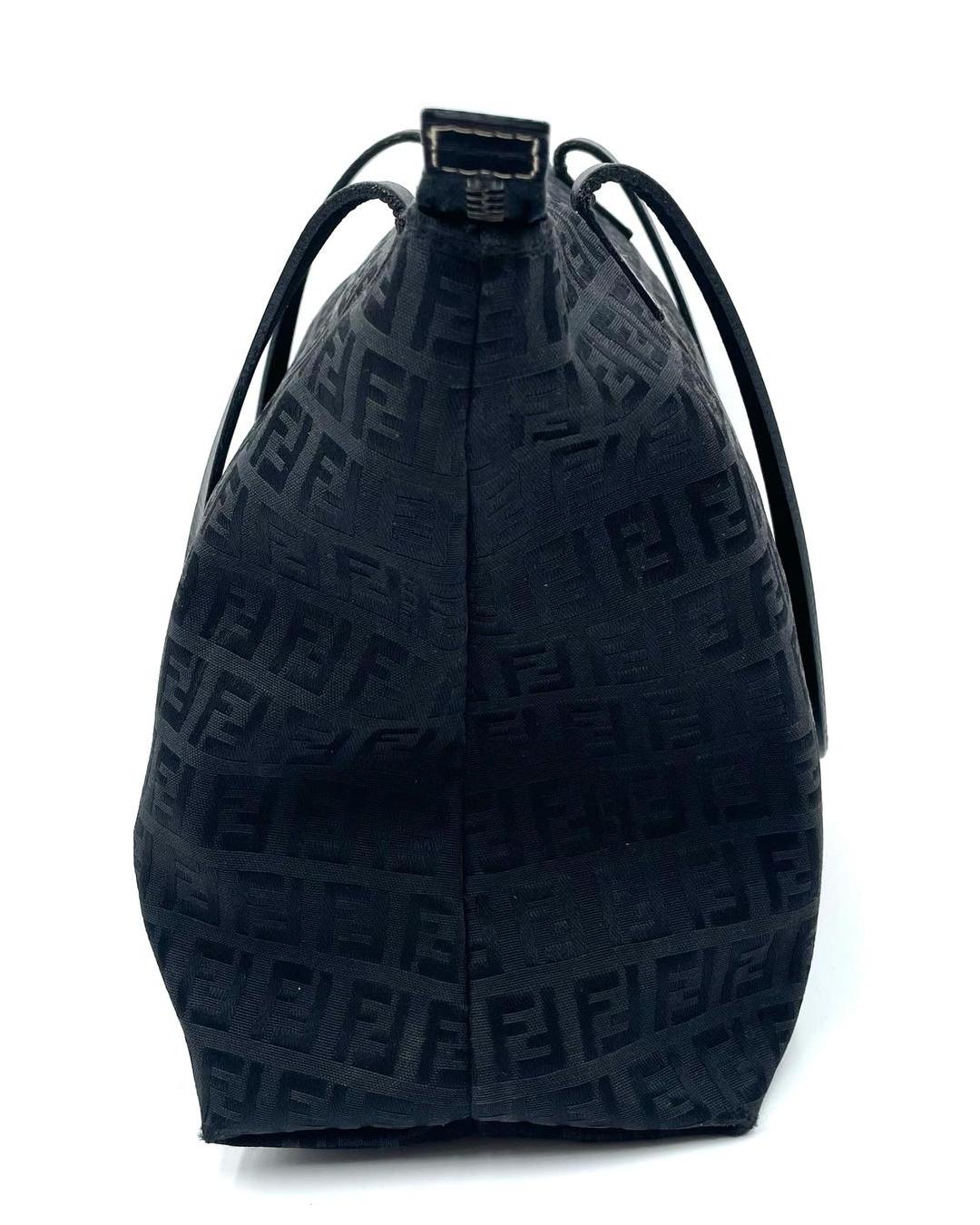 Fendi black Zucca monogram canvas shoulder tote with slim leather straps and top zip closure.