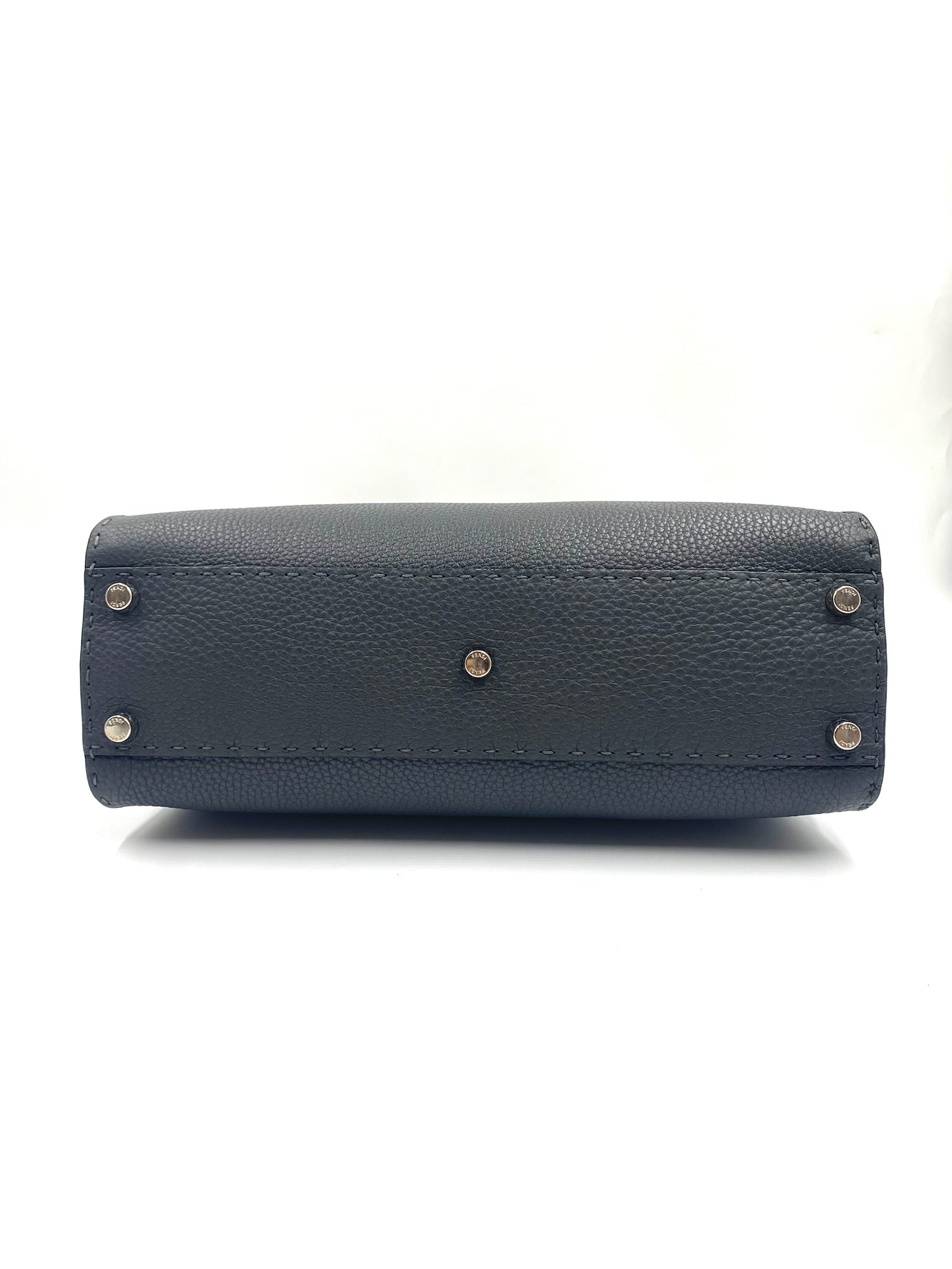 Bottom view of a Fendi Grey Selleria Leather Peekaboo Shoulder Bag with silver-tone protective metal feet.