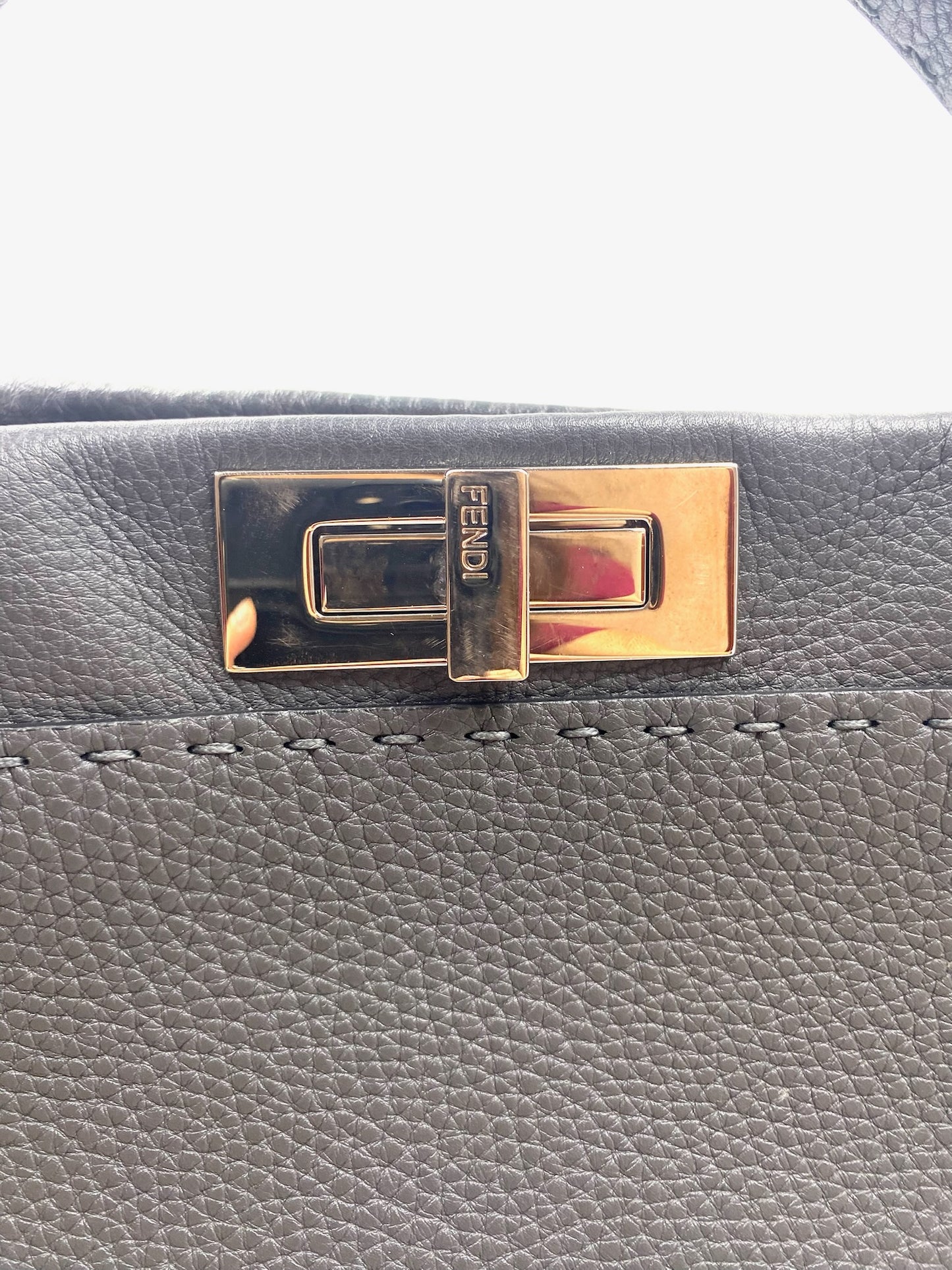 Close-up of Fendi Grey Selleria Leather Peekaboo bag with silver-tone turnstile lock and tonal stitching.