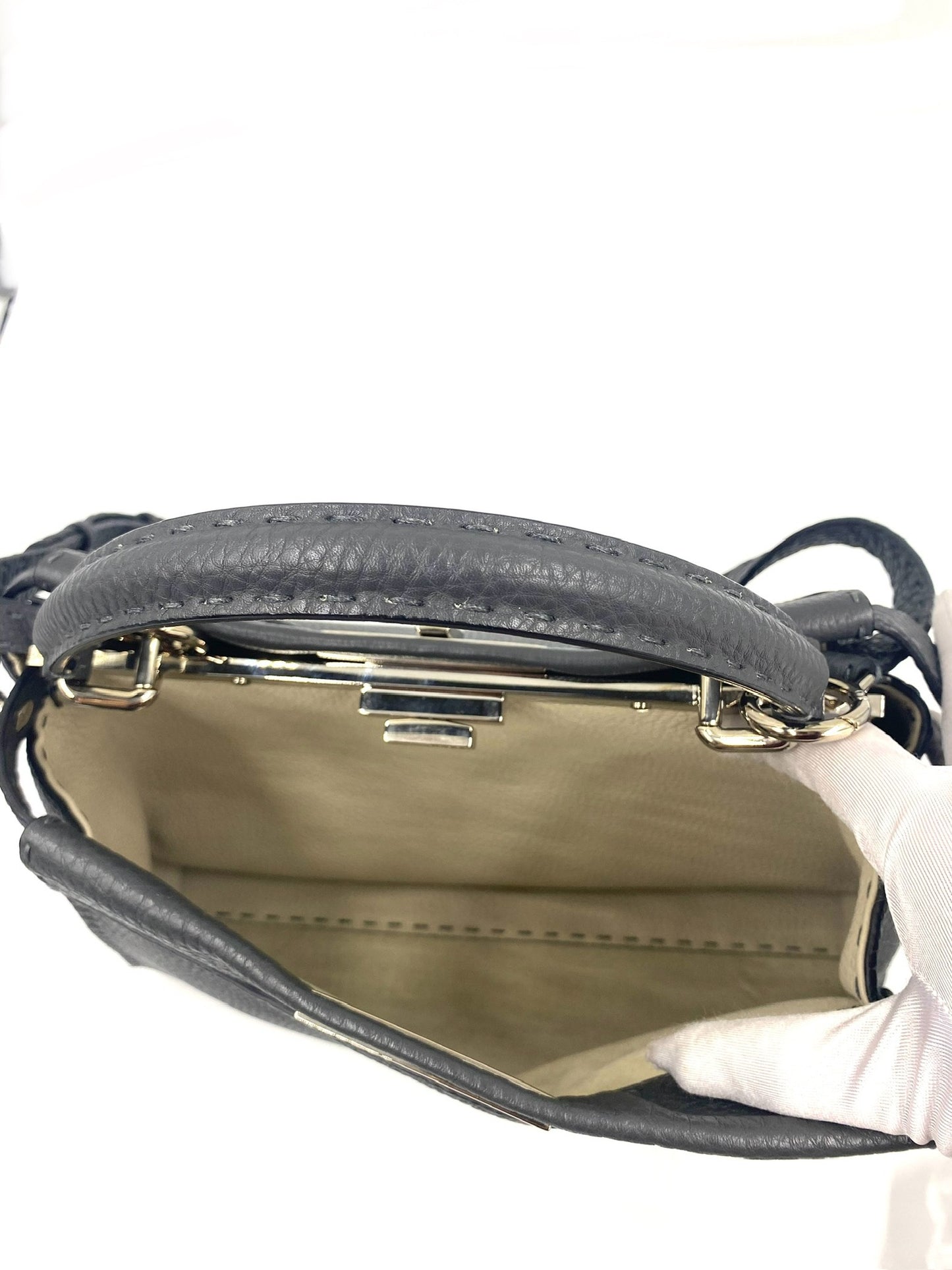 Open Fendi Grey Selleria Leather Peekaboo bag showing interior, top handle, and silver hardware.