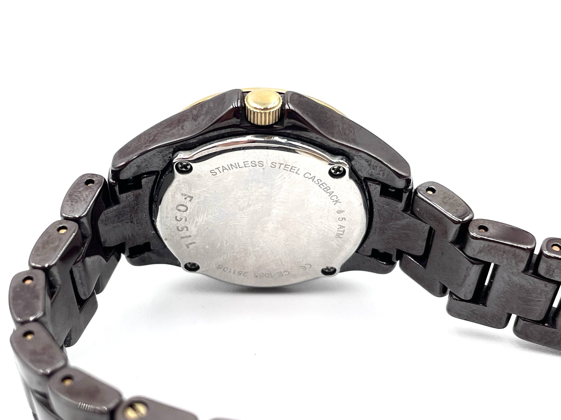 Fossil Tortoise Watch CE1055, stainless steel caseback, gold-tone crown, and dark tortoise-style link bracelet.