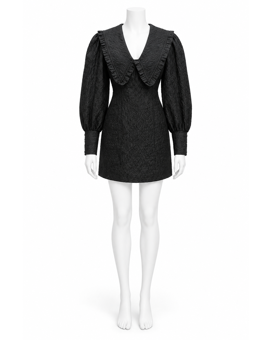 Ganni black jacquard organza mini dress with ruffled Peter Pan collar and cuffed balloon sleeves on a mannequin.