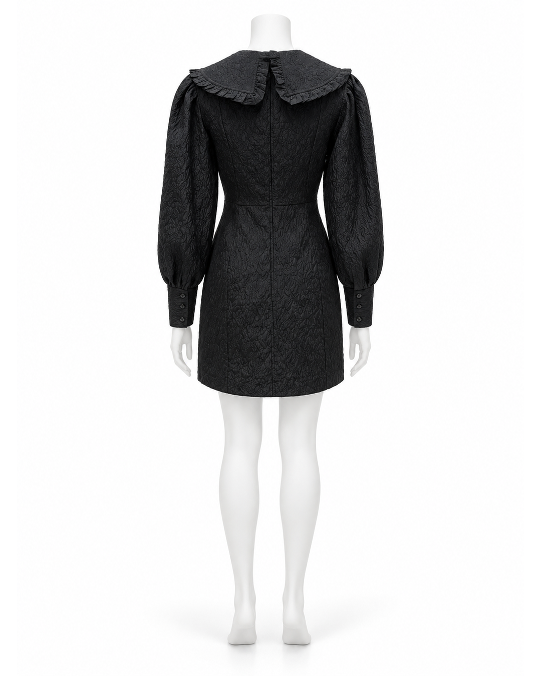 Back view of a black Ganni jacquard organza mini dress with a ruffled peter pan collar and cuffed balloon sleeves.
