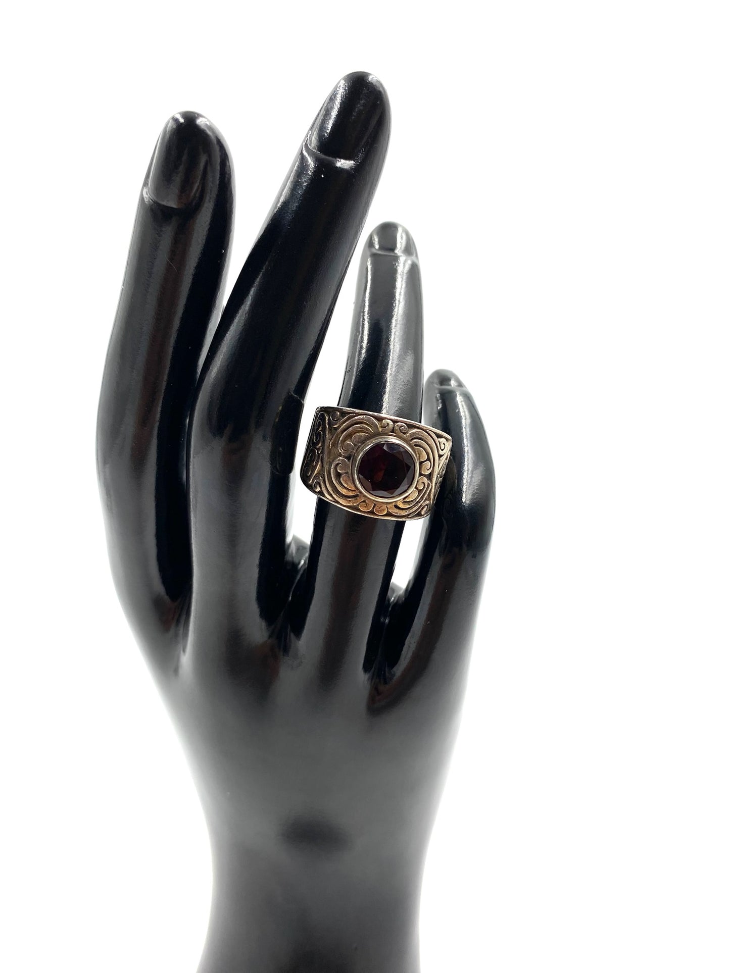 Garnet sterling silver ring size 6, featuring a dark red oval stone on a wide band with etched gold-tone accents.