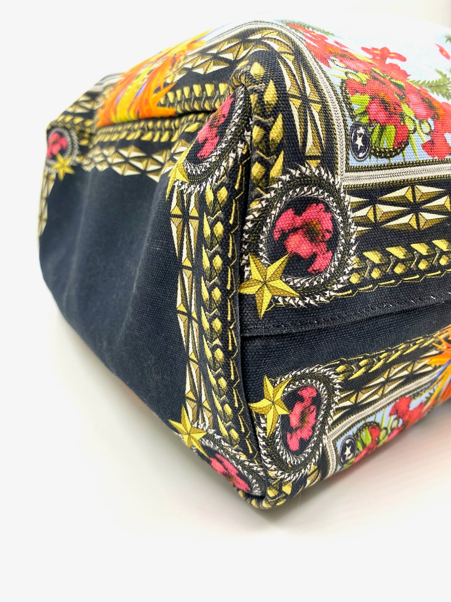 Givenchy Antigona Multicolor Printed Tote with vibrant floral and geometric patterns, black base, and gold accents.