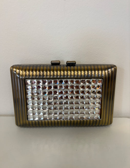 Rectangular gold clutch with a ribbed metal frame and a central panel of sparkling square crystals.