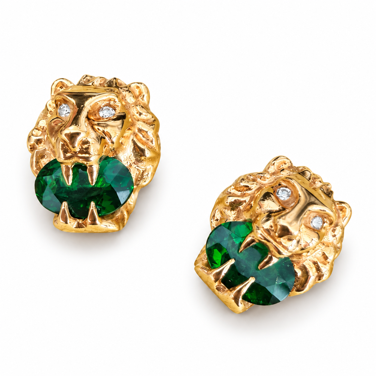 Gucci 18k gold lion head stud earrings featuring green diopside stones and sparkling white diamond eyes.