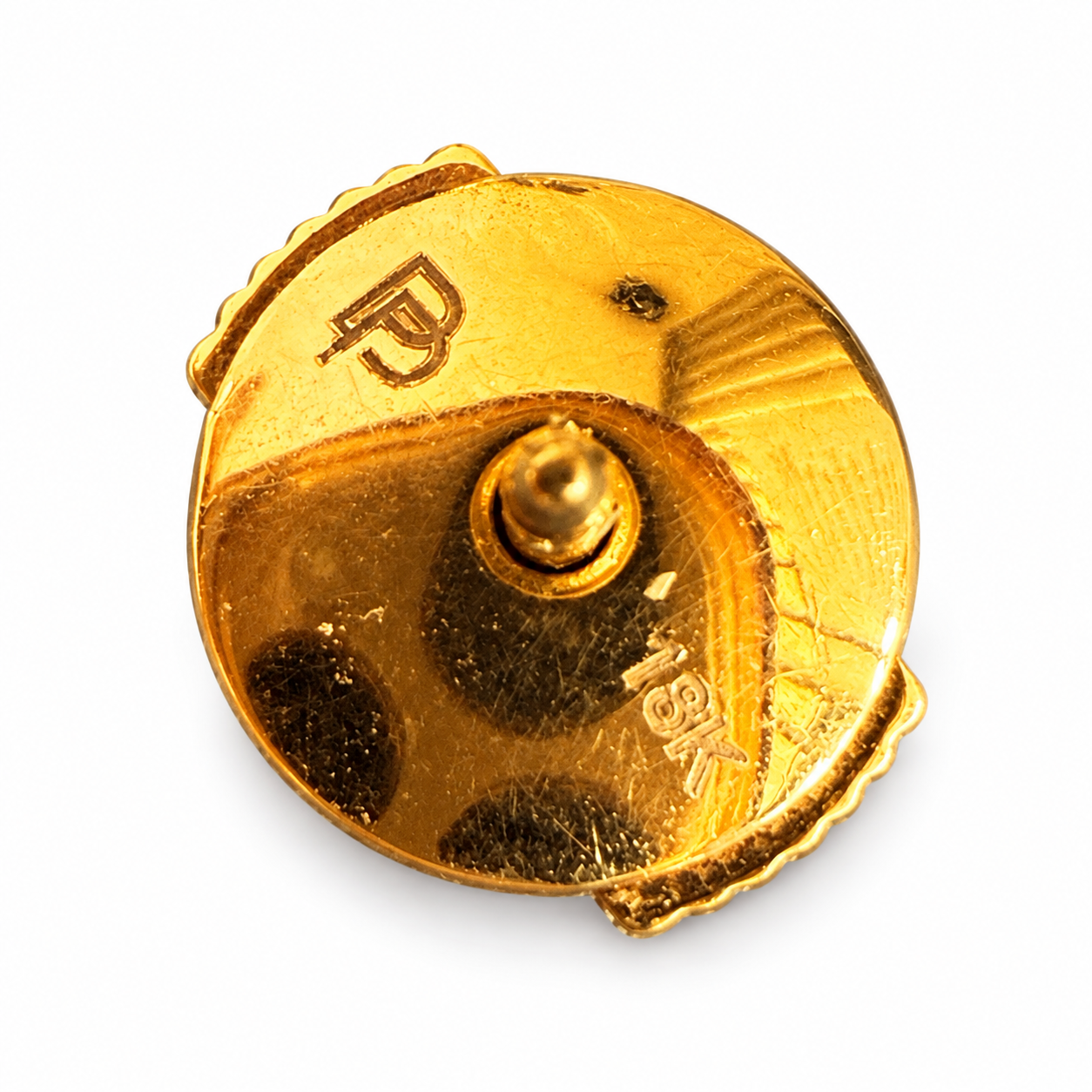 Back view of a Gucci 18k yellow gold earring screw-back with hallmark and 18k stamp on a white background.