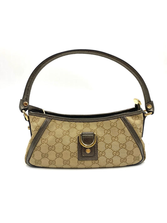 Gucci GG Canvas Abbey mini top handle bag with brown leather trim, gold-tone hardware, and Abbey insignia.