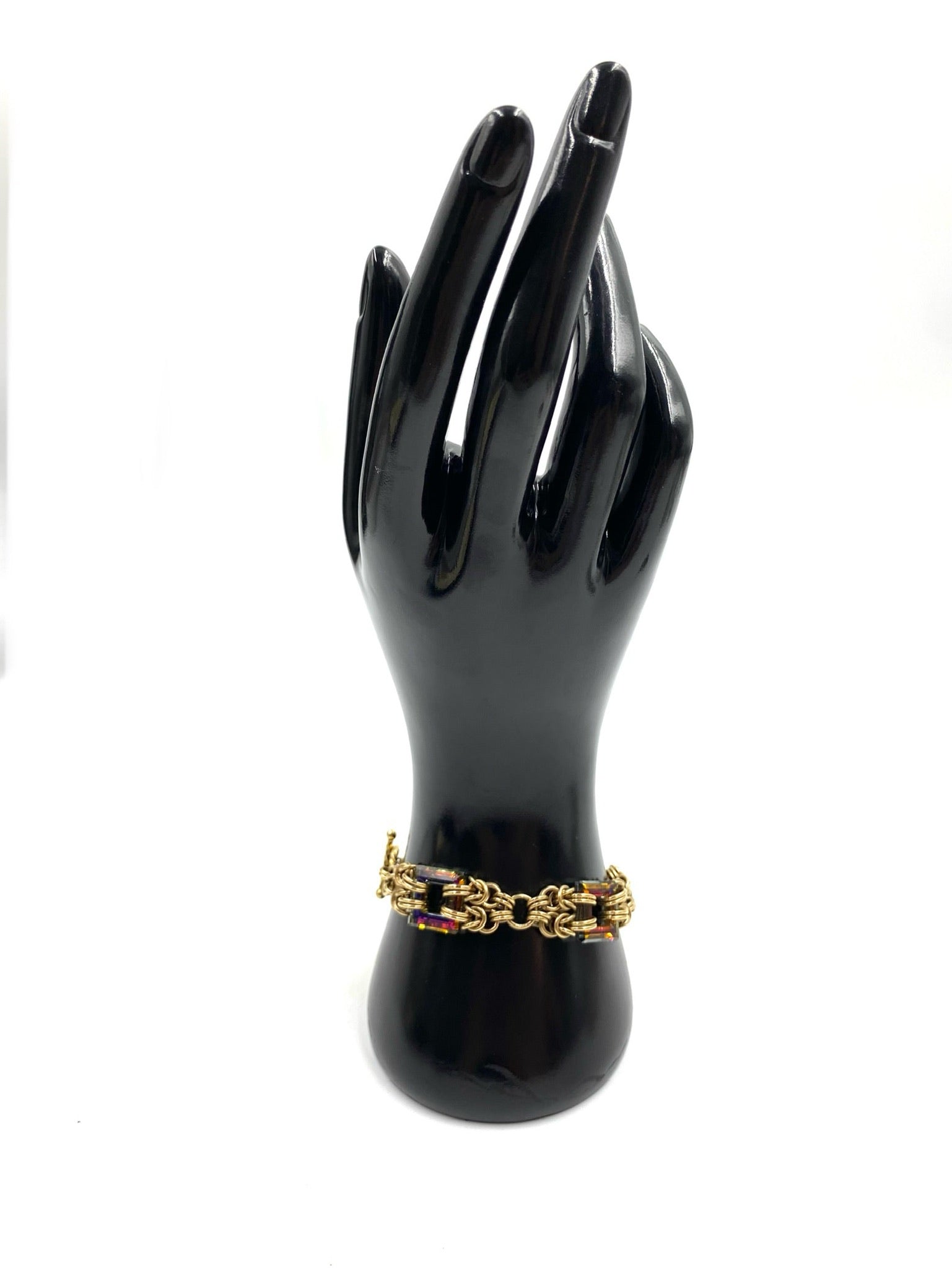 Gold filled Byzantine bracelet with square heliotrope stones on a black mannequin hand.