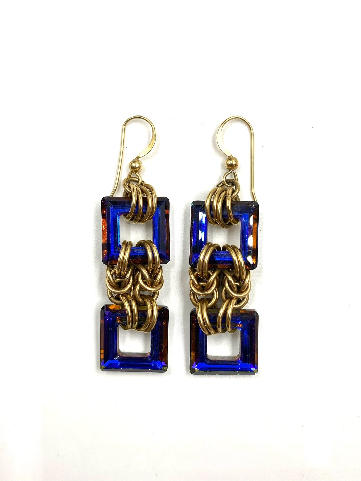 Heliotrope Byzantine gold filled earrings with two square blue stones linked by gold chains.