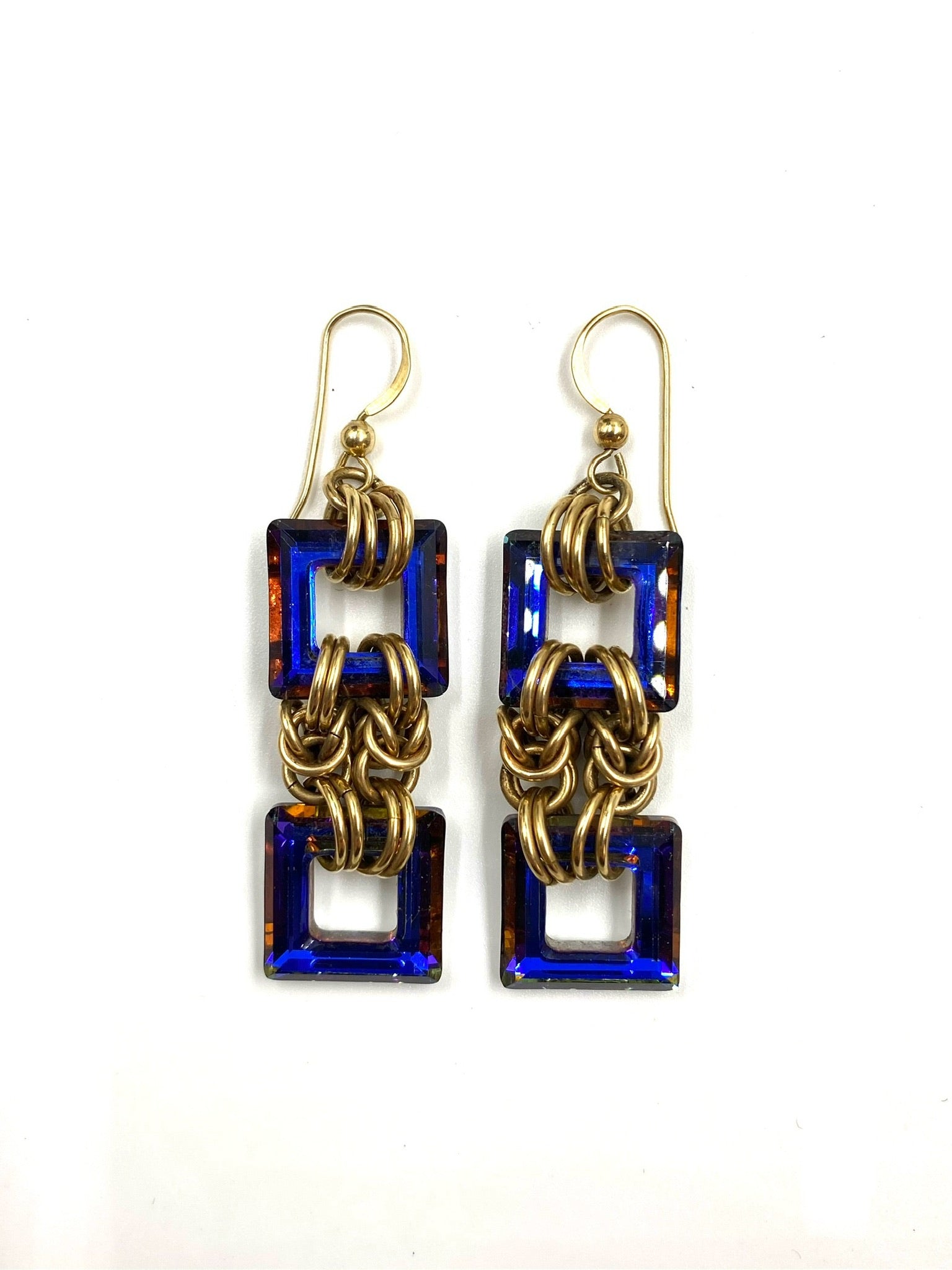 Heliotrope Byzantine gold filled earrings with two square blue stones linked by gold chains.